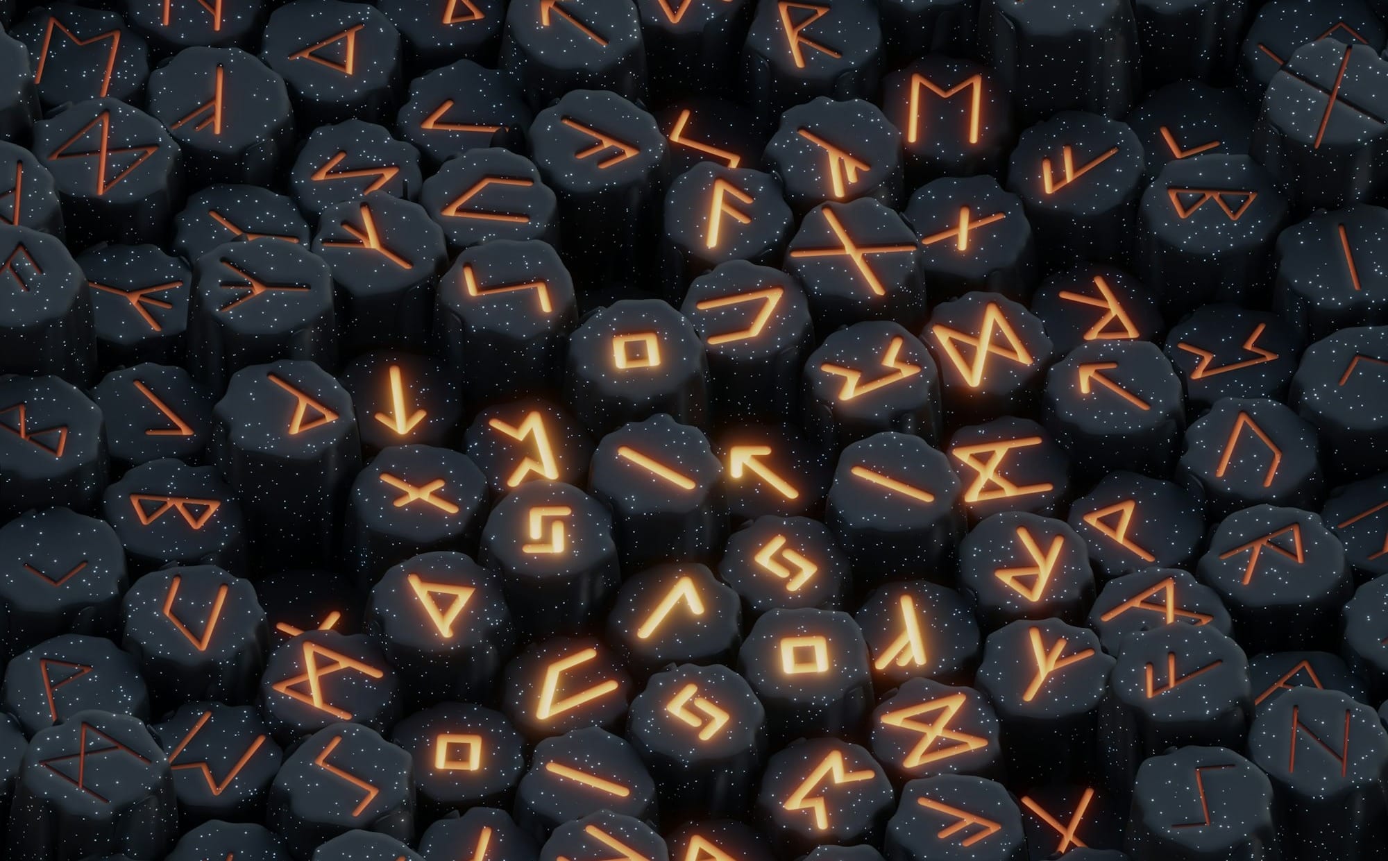 a pile of black rocks with orange letters on them